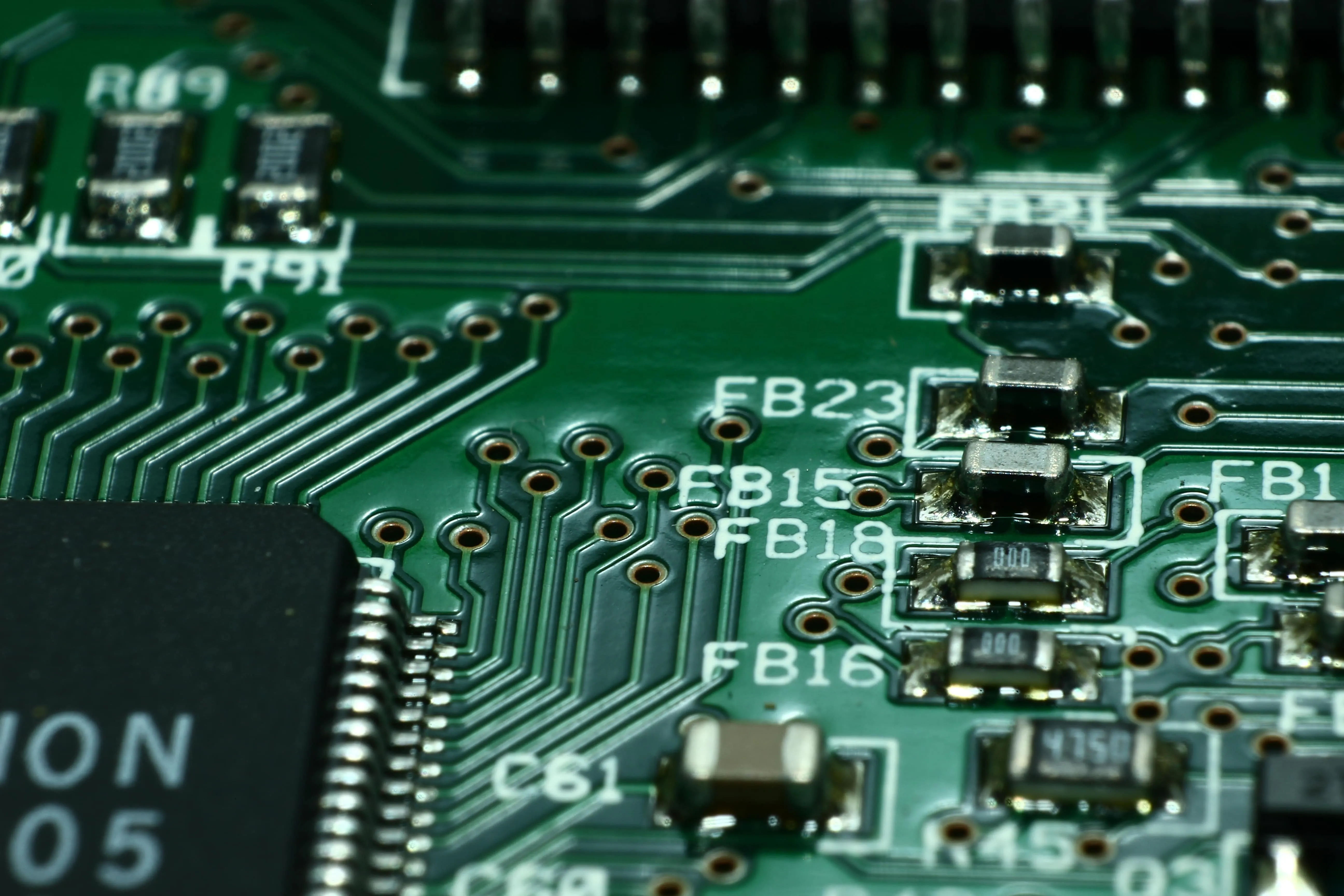 Close-up of a hand-assembled Simgen circuit board showing precise soldering and component placement